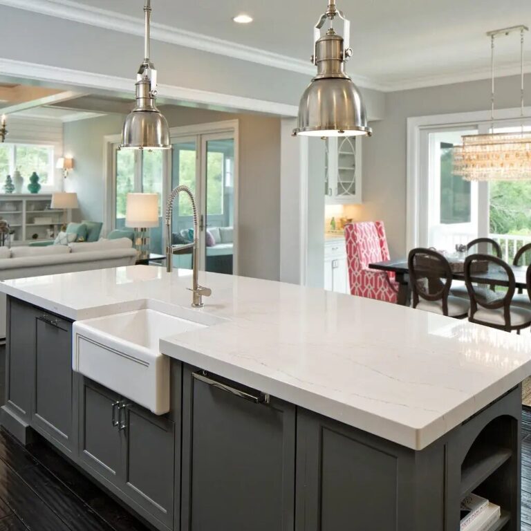 grey kitchen island cabinetry with white solid surface counter
