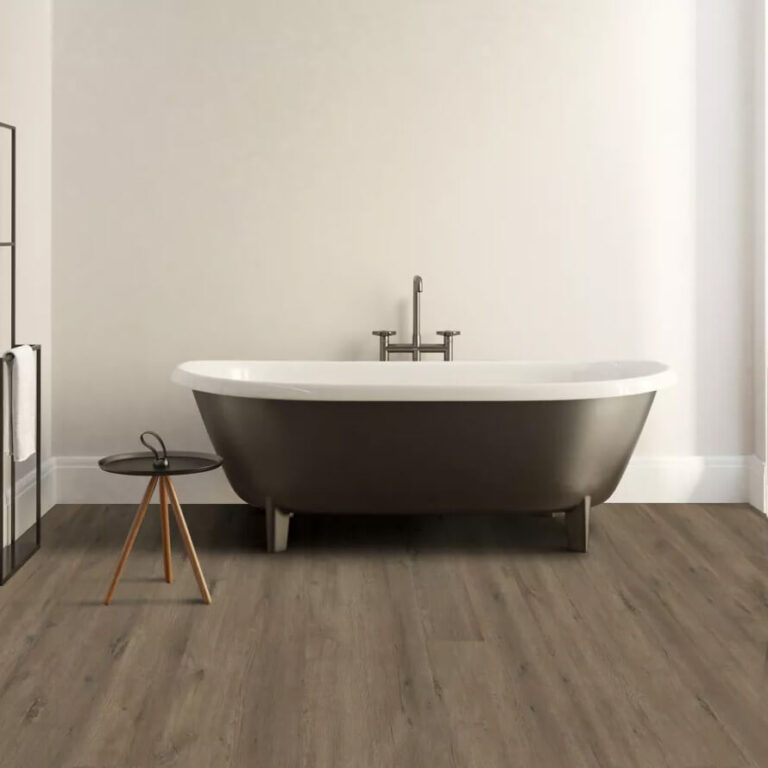 light brown vinyl flooring used in a a bathroom with a free standing soaker tub