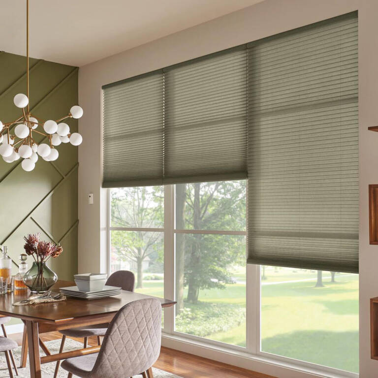 light green cellular shades in a dining room