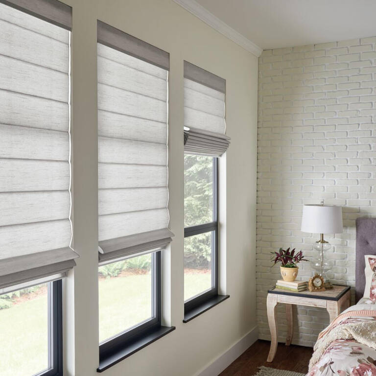 Graber roman shades in off-shite in a bedroom