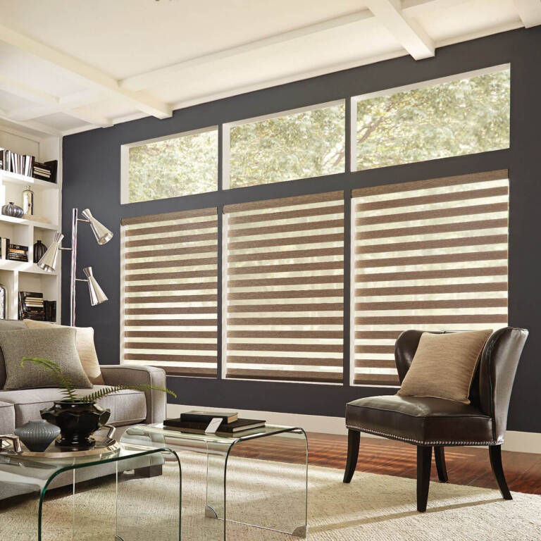 Graber layered window shades covering three large family room windows