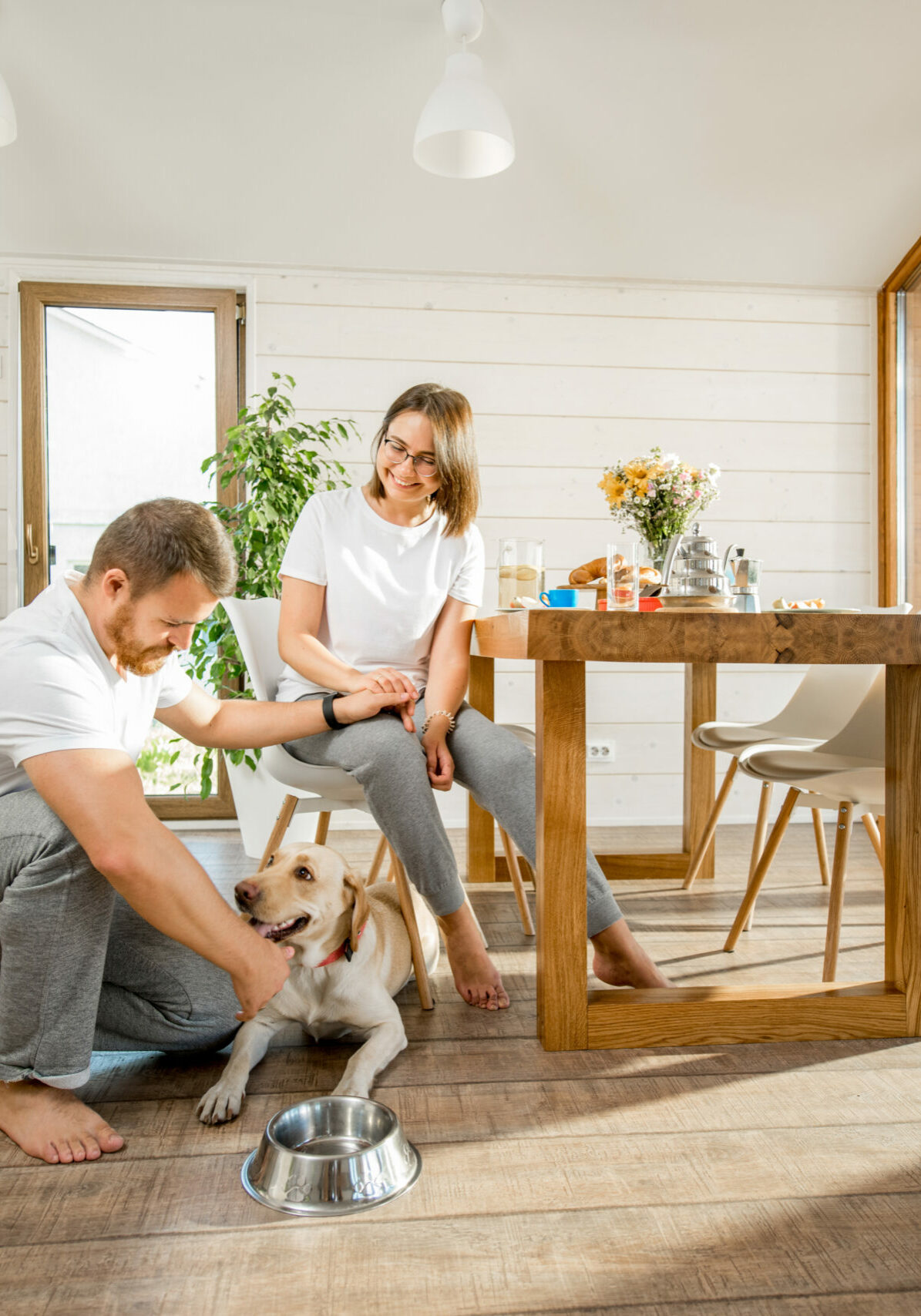 Young couple with dog at home | Floor to Ceiling Sycamore